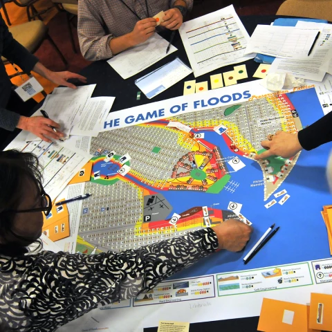 "The Game of Floods" board game with participants "The Game of Floods" board game with participants