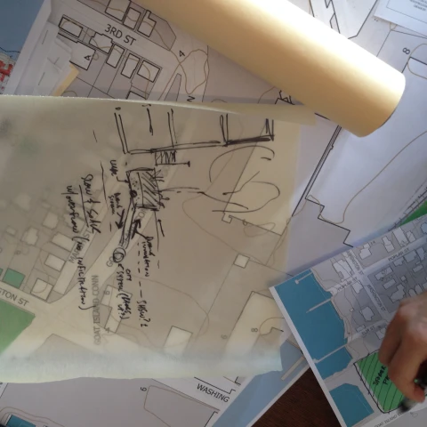 Line drawings and plans on a table Line drawings and plans on a table