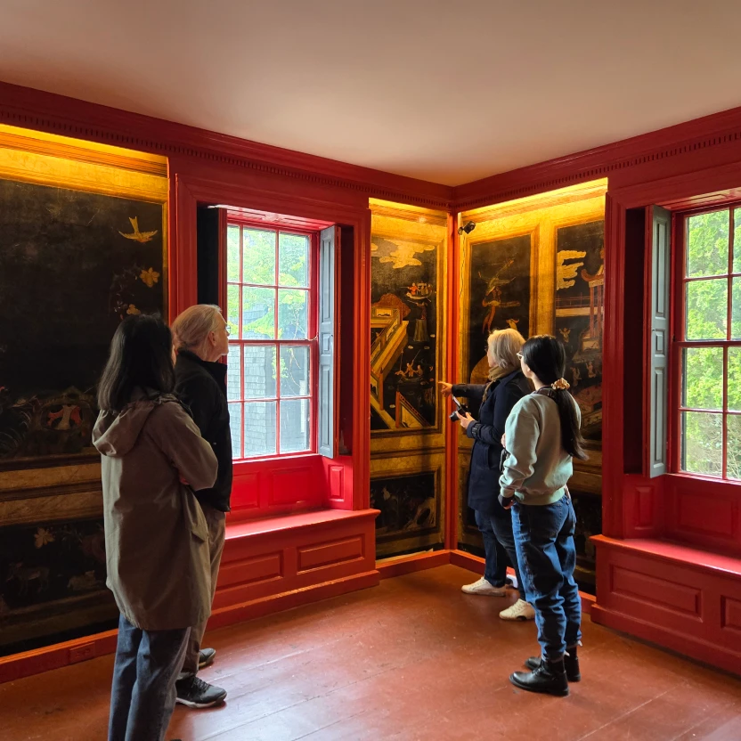 People viewing an interior wall mural